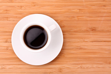 Coffee cup on wooden surface