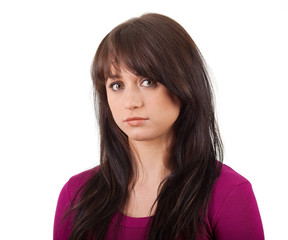 Fototapeta premium Serious girl in a red shirt on white background
