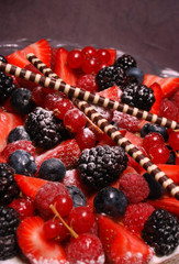 A close up of a french red summer fruit tart