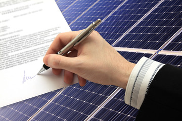 Signature of Business Contract in front of Solar Power Station