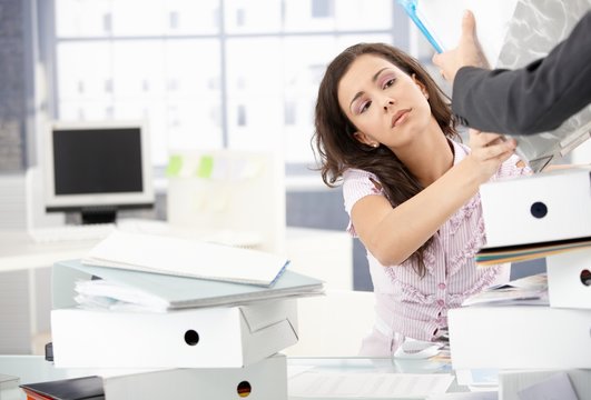 Desperate office worker getting new folders