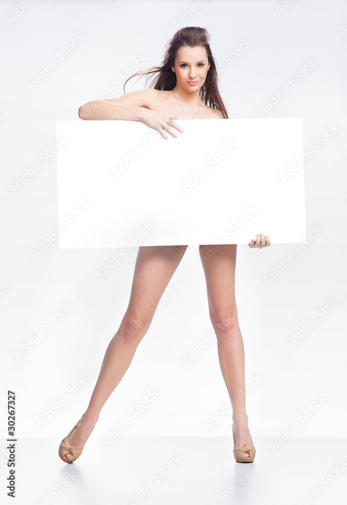 Wall mural young happy woman over white board