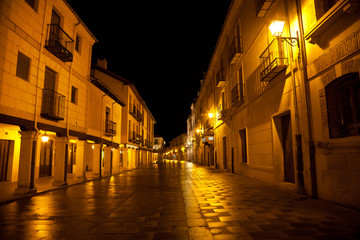 Main street with arcades at night. Burgo de Osma, Soria