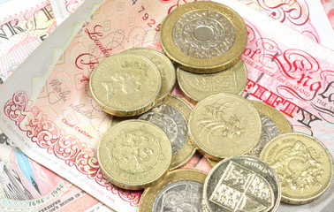 pound coins on monety background