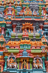 Fototapeta na wymiar Sculptures on Hindu temple tower