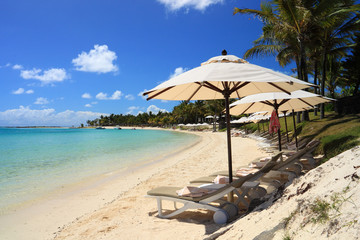 Beach Chairs and Umbrellas in tropical island