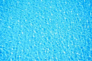 blue swimming pool with ripple water and reflection