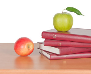 apple and books on desk