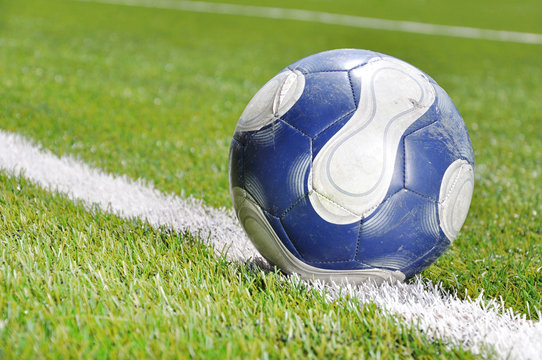 Soccer ball on the grass field