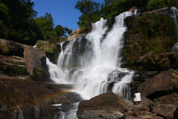 Fototapeta na wymiar A man photograph waterfall, north of Thailand
