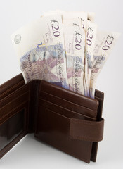 brown wallet of cash