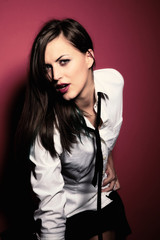 Fototapeta premium Beautiful girl on red background