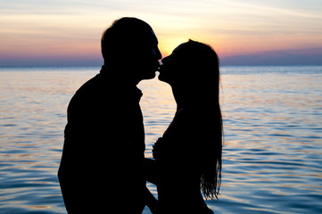romantic couple kiss on the beach