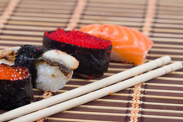 Traditional japanese sushi and rolls close up