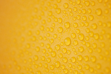 Abstract water-drops on yellow