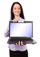 Latin businesswoman holding a laptop with copyspace on screen