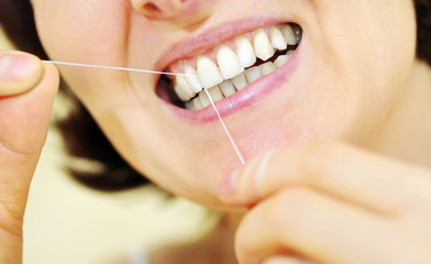 woman with some dental floss