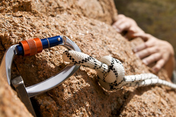 Rockclimber's hands of rising on rock
