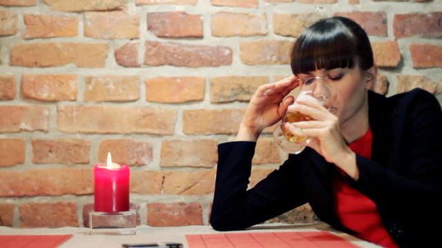 Sad and lonely young woman in restaurant