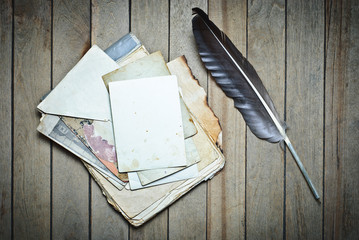 Vintage notebook old papers empty blank and feather