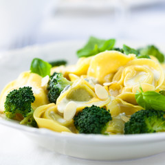 Tortellini with blue cheese sauce, broccoli and flaked almonds