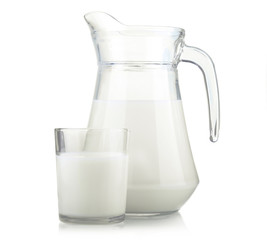 Jug and glass of milk isolated