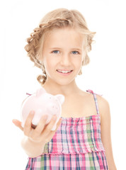 little girl with piggy bank