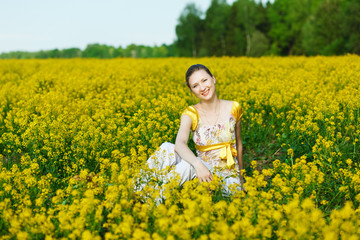 Fototapeta premium happy woman on yellow field