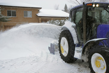 Residential snow removal contractor at work
