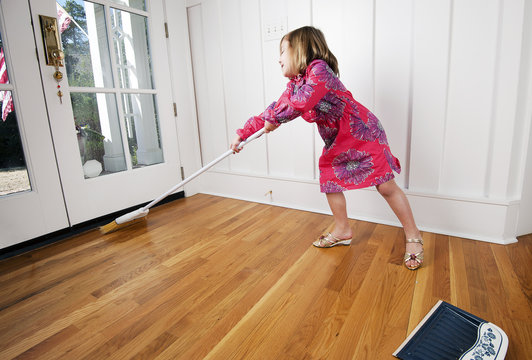 Kid Cleaning Up Sweeping Floor