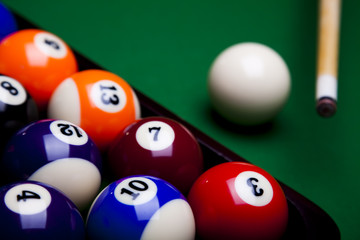 Pool game balls against a green