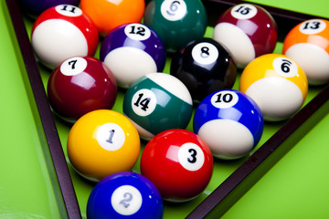 Pool game balls against a green