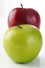 red and green apple on background