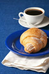 Croissant and black coffee