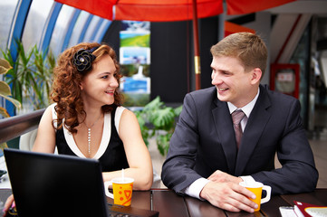 Joyful man and woman on business lunch