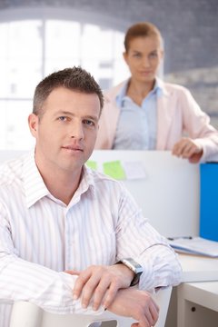 Portrait of middle-aged office worker smiling