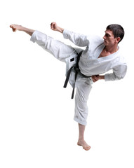 Karate. Man in a kimono hits foot