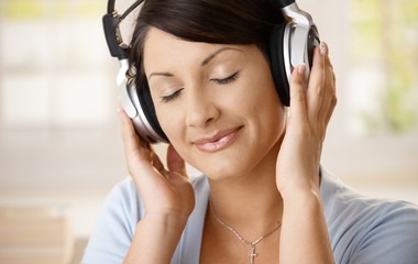 Woman listening music on headphones