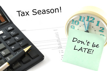 Concept Image with calculator and clock. Tax Season! Don`t be la