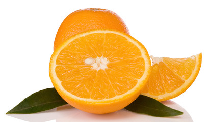 oranges and green leaves isolated on white