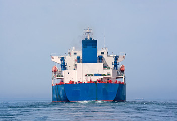 Fototapeta premium Aft of tanker sailing in the sea with water splashes