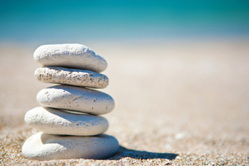 Stack of white stones on tropical beach