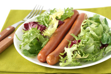 fried sausages with salad
