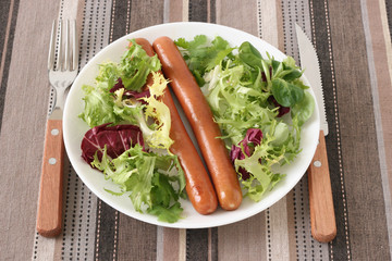 fried sausages with salad