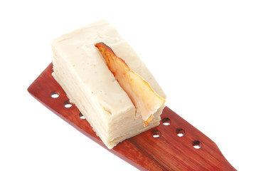 cream cake on wooden spatula