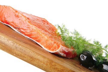 pink salmon on wooden plate with cheese