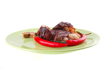 roast meat chunks on green plate