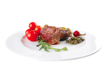 grilled meat medallion served on white