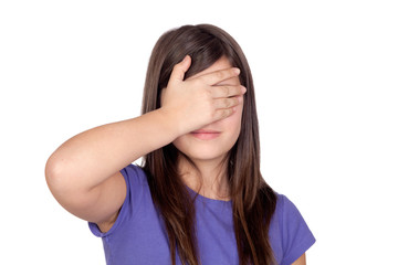 Adorable preteen covering her eyes