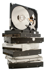 hard drive disks pile with one open on top on white